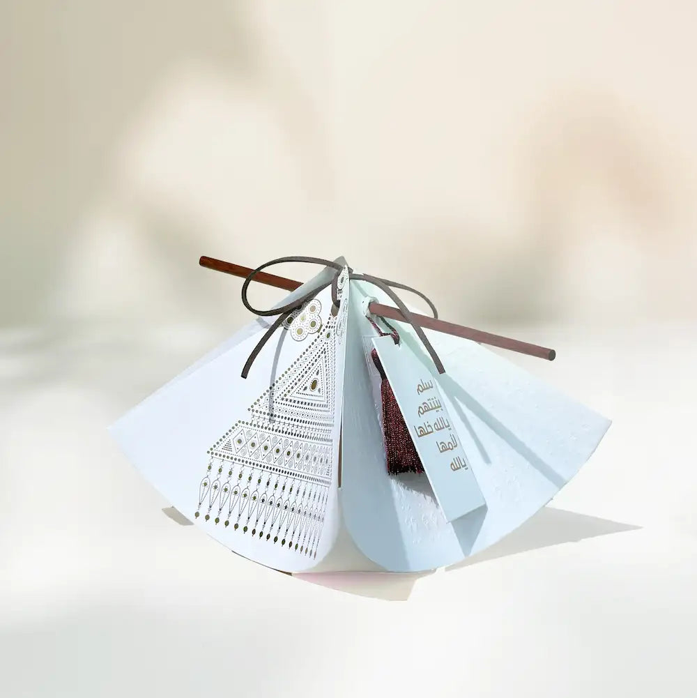 Hag Ellaila bindle gift wrap with Emirati jewellery print and tassel tag