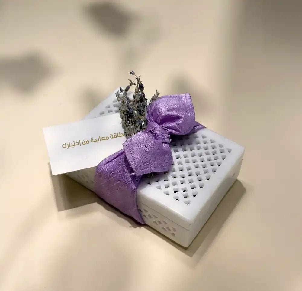 White marble cash box with lavender bow, dried flowers and greeting card