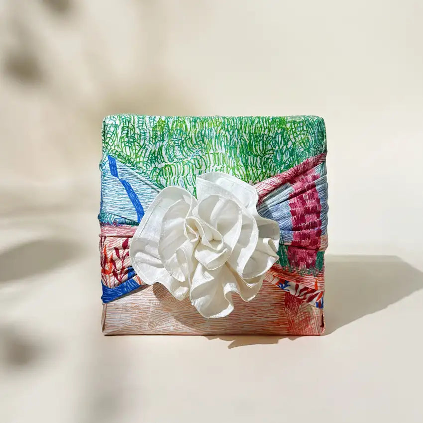 Gift wrapped in Sanctuary print fabric finished with a white fabric flower