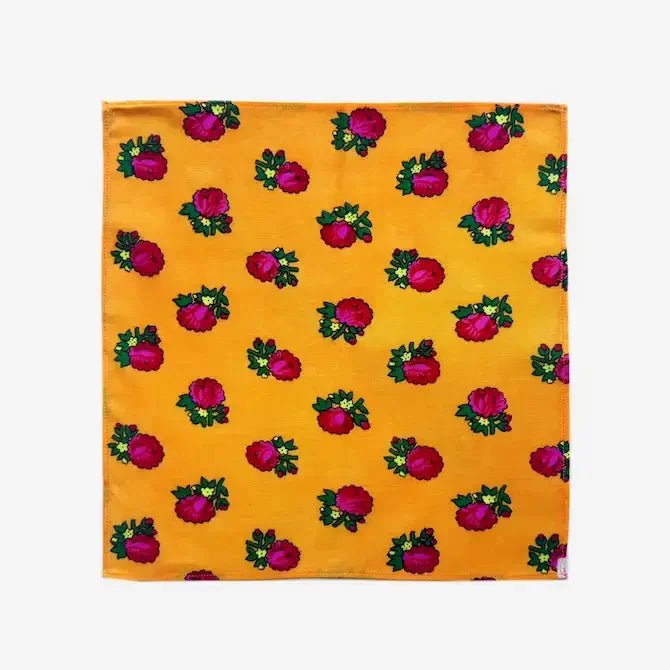 Yellow floral printed fabric gift wrap laid flat, full view