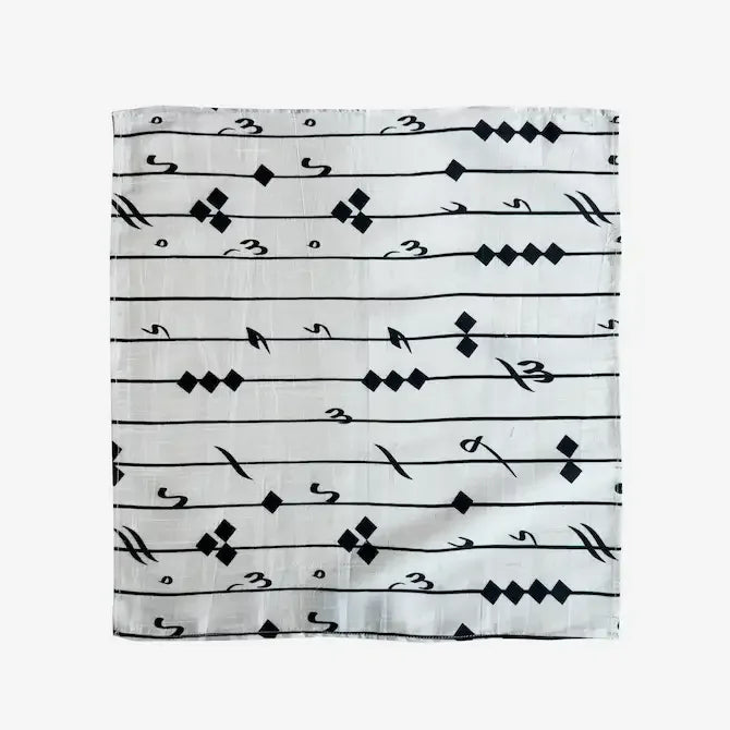 Black and white printed fabric gift wrap with calligraphy-inspired line pattern, flat view