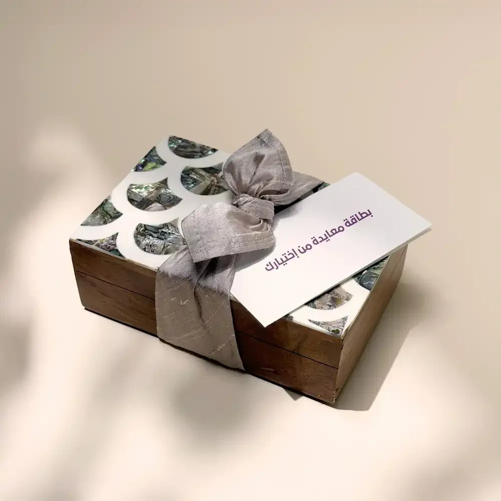 Rosewood cash box with abalone-pattern lid, taupe fabric bow and greeting card