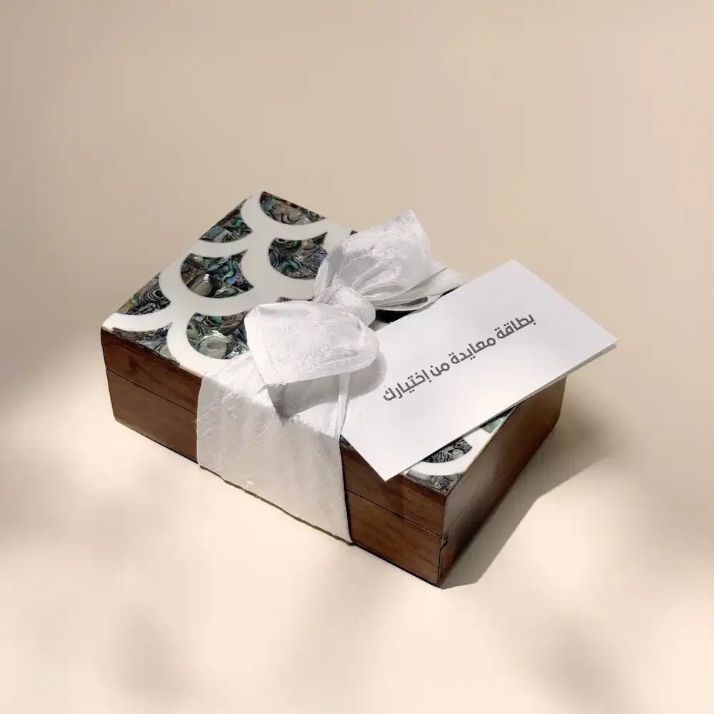 Rosewood cash box with abalone-pattern lid, off white fabric bow and greeting card