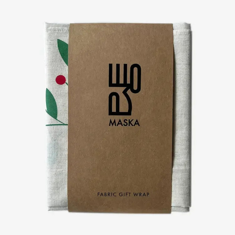 Folded holly berry calico wrap with Maska kraft fabric gift wrap sleeve