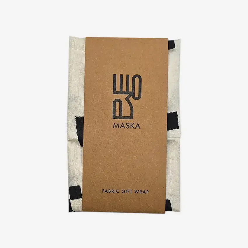 Diagonal dots fabric wrap folded with kraft Maska fabric gift wrap band