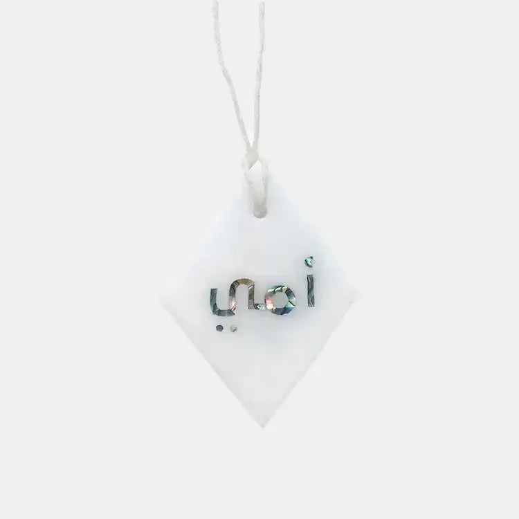 Diamond-shaped marble trinket with mother-of-pearl Arabic script on white cord