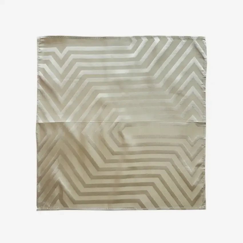 Sand jacquard striped fabric gift wrap laid flat, chevron pattern in soft neutral tone