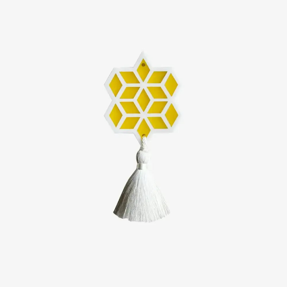 Yellow and white acrylic trinket with Islamic geometric pattern and white tassel