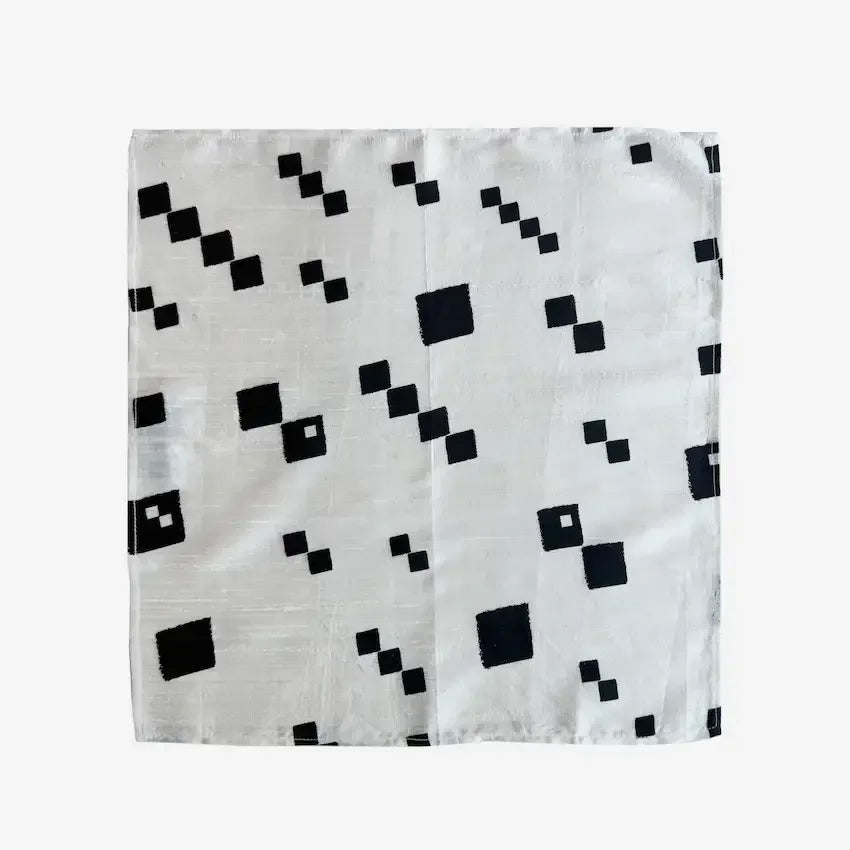 Black and white diagonal dots fabric gift wrap laid flat, full view