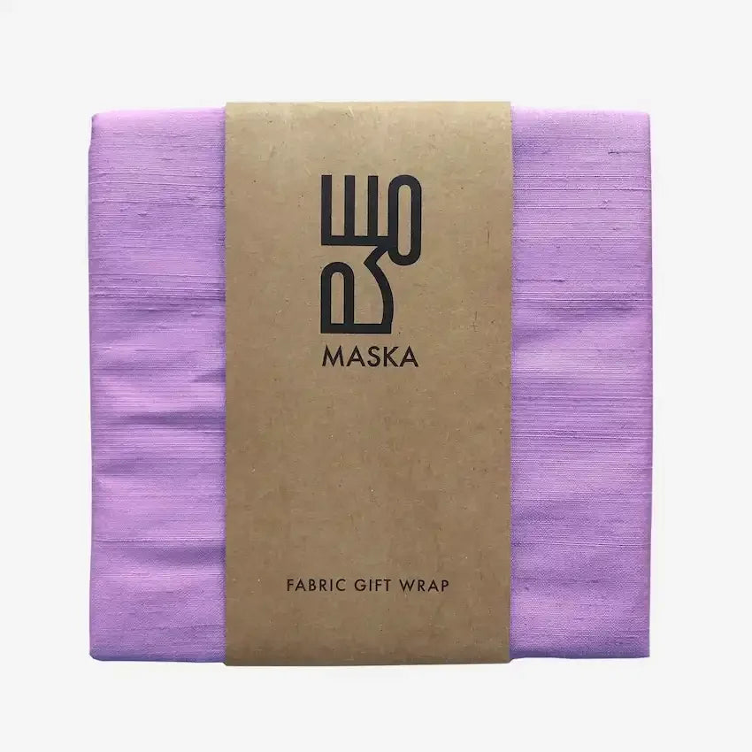 Folded lavender raw silk gift wrap with kraft Maska fabric wrap band