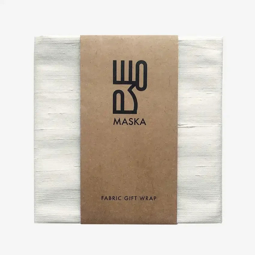 Off white raw silk gift wrap folded with Maska kraft paper band
