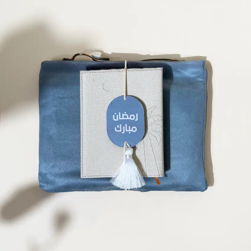 Blue velvet prayer pouch with Ramadan Mubarak tag and embossed Quran cover