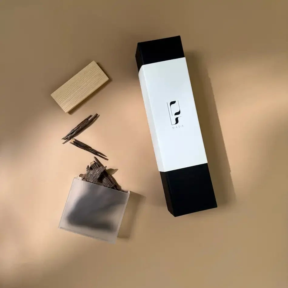 Mada chrome oud burner box with wooden chips and Hindi Seufi oud beside wood block