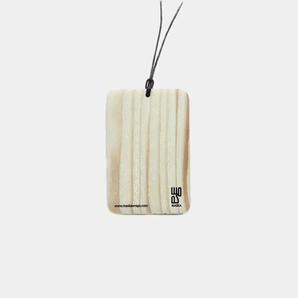 Back view of wood trinket showing natural grain and Maska logo stamp